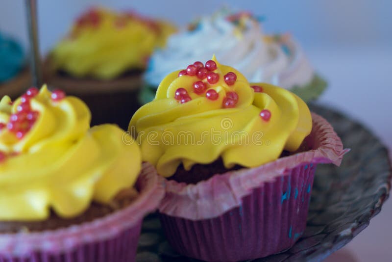 Yellow Cupcake Frosted with Many Colorful Cupcakes Stock Image Image