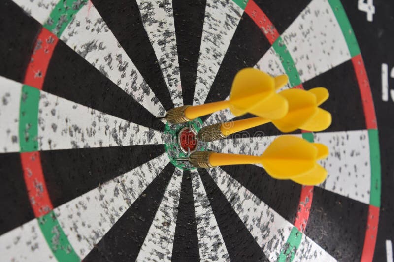 Yellow Darts Around the Bullseye of a Dartboard Stock Photo Image of