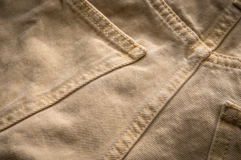 Yellow denim fabric close-up, distinct texture. Abstract background royalty free stock photos