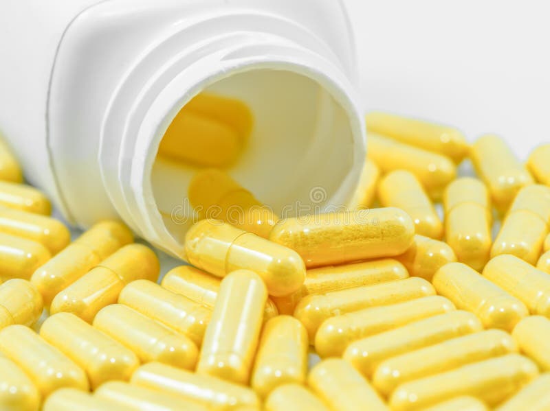 Yellow Drug Capsules Spilled from Container Stock Photo Image of