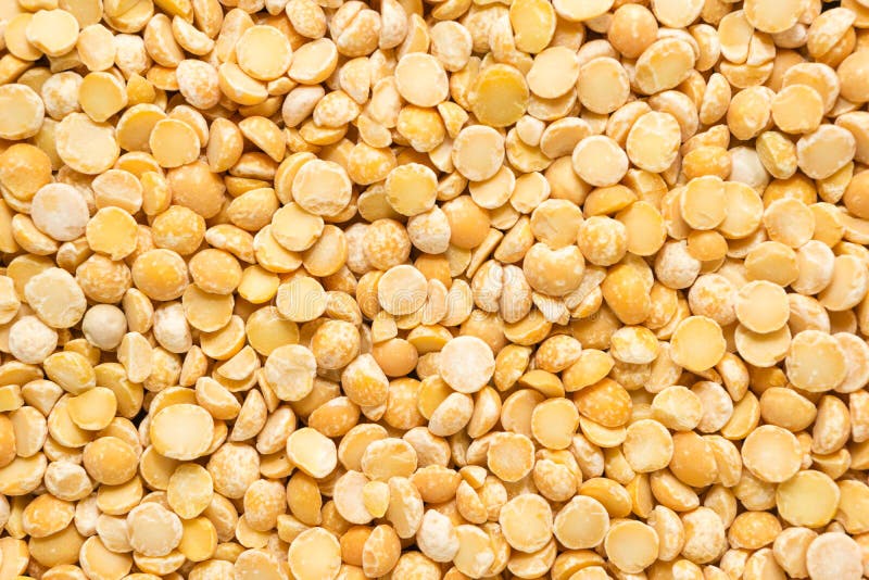 Yellow Dry Peas Background Texture, Split Dried Peas Closeup Stock