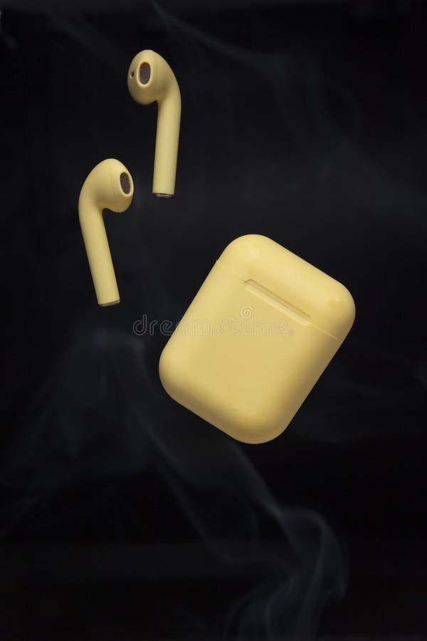 Yellow Earphones with Wireless Charging Case with Smoke.
