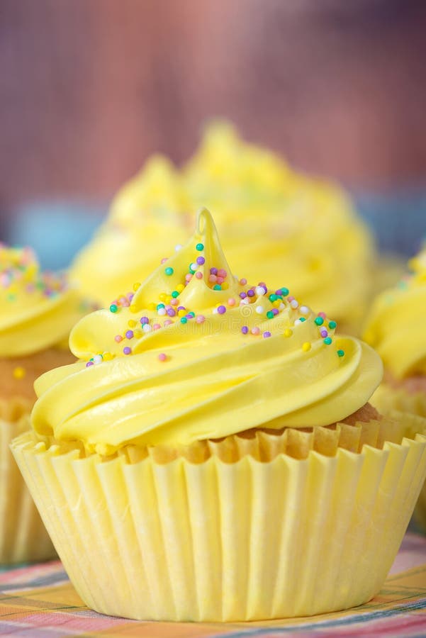Yellow Easter Cupcakes With Candy And Sprinkles Stock Image Image of