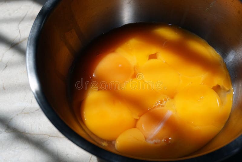 Yellow Egg White Yolk Baking Ingredient in a Bowl on Table Light Shadow