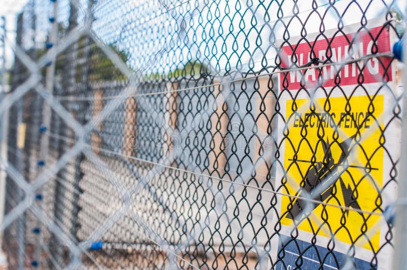 Yellow electric fence. stock photo. Image of authorised 91038262
