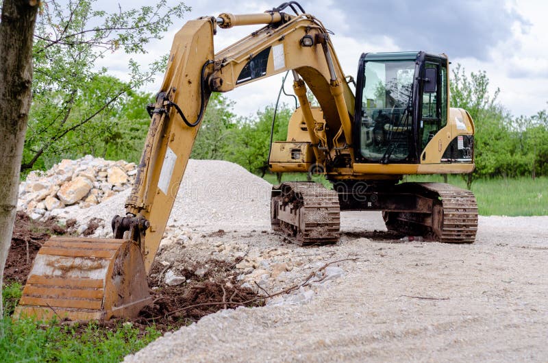 Yellow excavator at a construction site