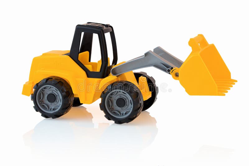Yellow excavator isolated on white background with shadow reflection. Plastic child toy on white backdrop. royalty free stock images Yellow excavator isolated on white background with shadow reflection. Plastic child toy on white backdrop. royalty free stock images