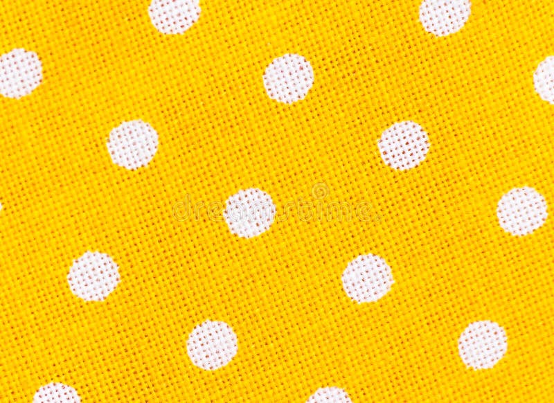 Pravidelné žltá textílie textúra pozadie s bielym bodky.