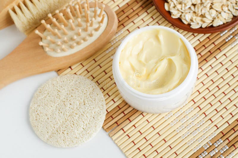 Yellow facial mask banana face cream, shea butter hair mask or body butter in the small white jar. Natural skin and hair care