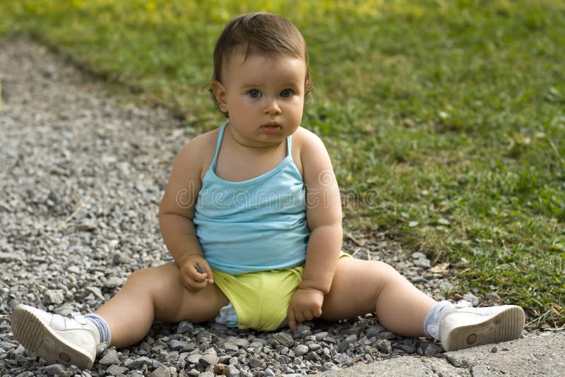 Child playing with stones