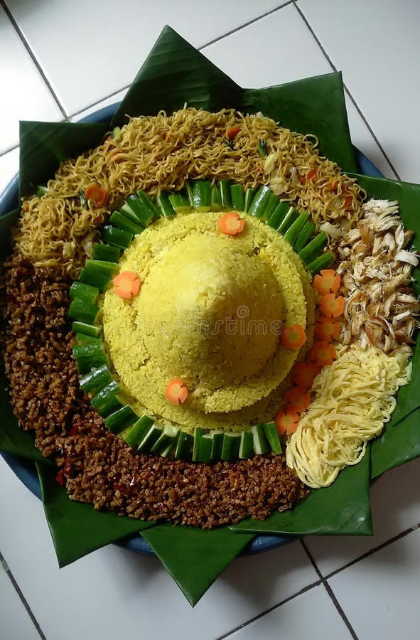 Yellow Food is Made from Rice and Side Dishes and Vegetables Around it