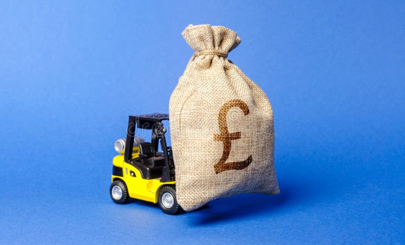 Yellow forklift truck carries a bag of pound sterling. Attracting investment in development, modernization of production royalty free stock photos Yellow forklift truck carries a bag of pound sterling. Attracting investment in development, modernization of production royalty free stock photos