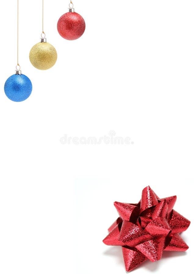 New Year's celebratory ornaments of three colors and gift bow of red color horizontally. New Year's celebratory ornaments of three colors and gift bow of red color horizontally