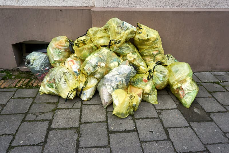 Yellow garbage bag stock image. Image of road, environment 25681759