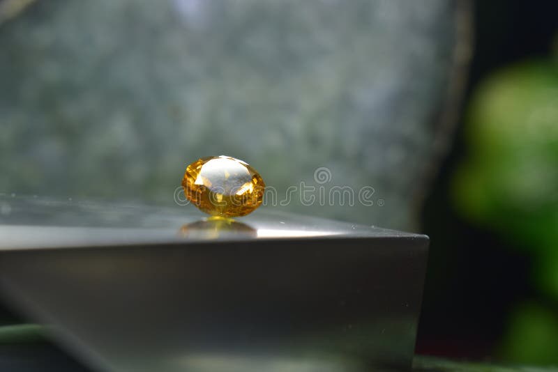 Yellow Gemstone is a Natural Gemstone that Has Been Cut through Stock