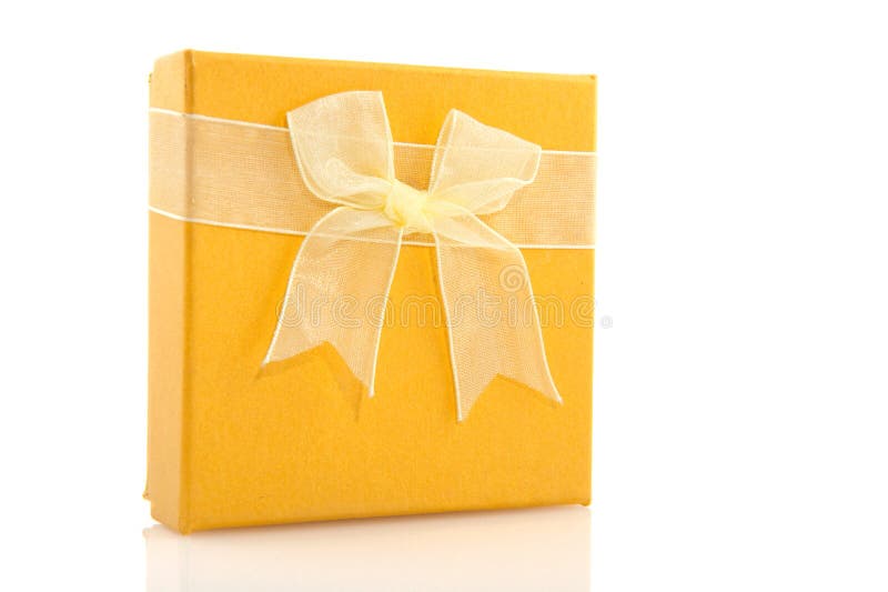 Yellow gift. Yellow luxury gift with ribbon and bow stock photo Yellow gift. Yellow luxury gift with ribbon and bow stock photo