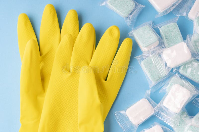 Yellow Gloves for Washing Up Liquid and Dishwasher Tablets Stock Image