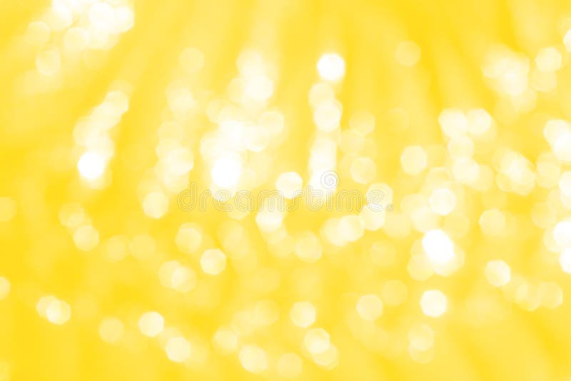 Close up Yellow or gold sparkle glitter abstract bokeh patterns on background