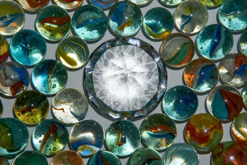Yellow, Green, Blue and Red Glass Marbles on a Table Stock Photo Image of clear, background