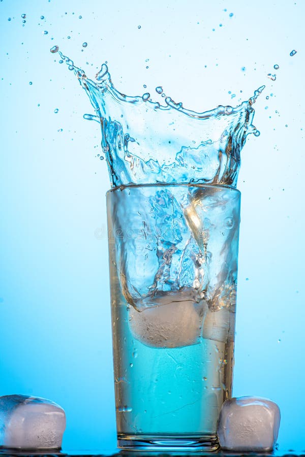 Yellow or Green Carbonated Lemonade in a Glass with Ice, Flow and Splash Stock Photo Image of