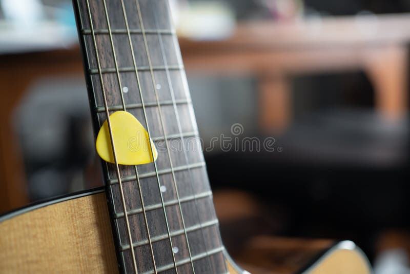 Red Pick on Acoustic Guitar String in Zoom View Stock Photo Image of