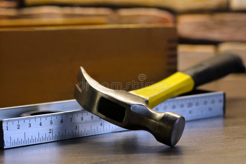 Yellow Hammer and Level for Repair and Construction Stock Image Image