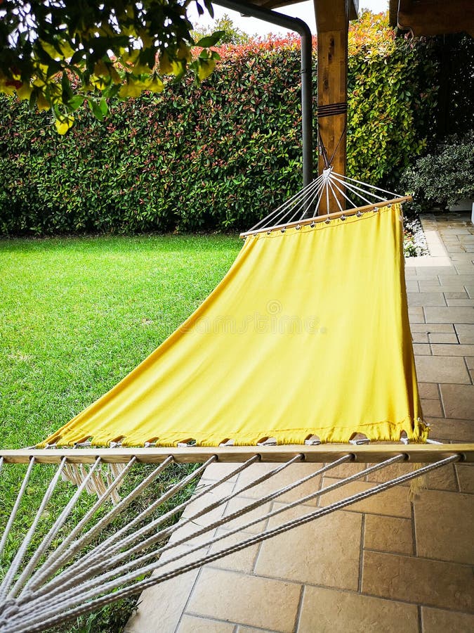 Man on Yellow Hammock in Summer Mountains Stock Photo Image of