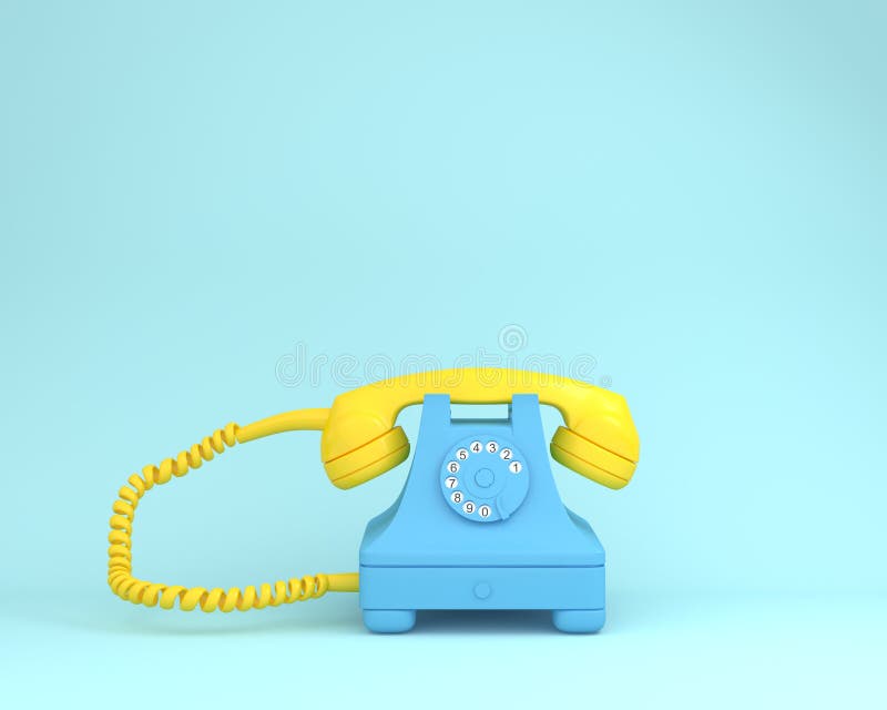 Yellow headphone against blue retro telephone on light blue colo stock photo