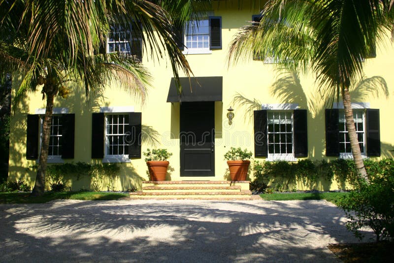 Yellow home with black shutters