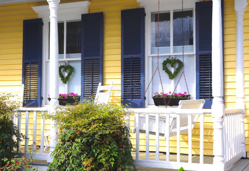 Yellow House, Porch Swing, and Flowers
