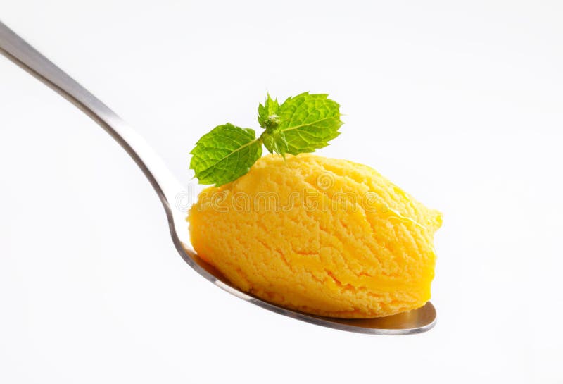 Yellow ice cream on spoon stock photo. Image of dessert 39786962