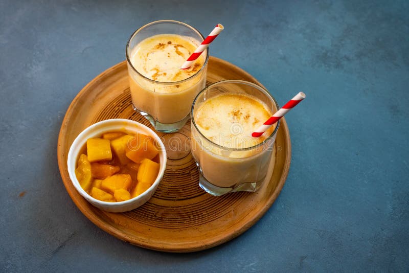 Yellow Indian Mango Yoghurt Drink Mango Lassi or Smoothie with Turmeric ...