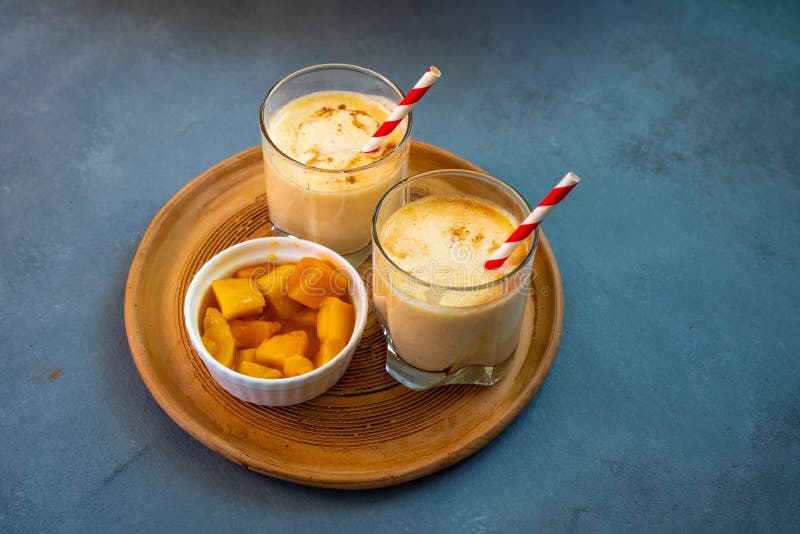 Yellow Indian Mango Yoghurt Drink Mango Lassi or Smoothie with Turmeric ...