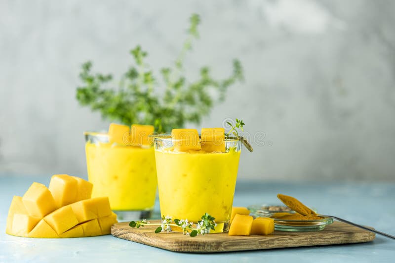 Yellow Indian Mango Yogurt Drink Mango Lassi or Smoothie with Turmeric ...