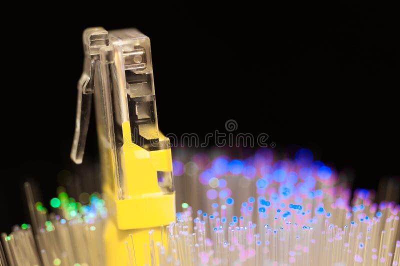Yellow internet switch close up macro shot , blue , green optical fibres. royalty free stock photography Yellow internet switch close up macro shot , blue , green optical fibres. royalty free stock photography