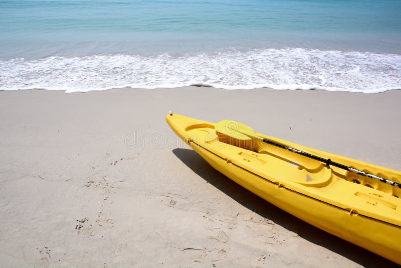 Yellow kayak on the beach stock images Yellow kayak on the beach stock images