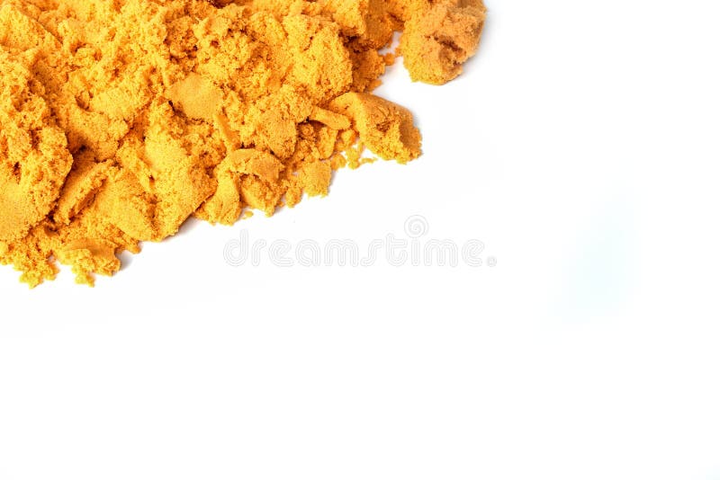 Top View Yellow Kinetic Sand with Molds. Magic Sand for Children