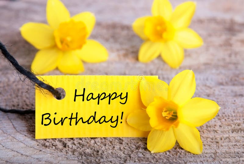 Yellow Label with Happy Birthday and Daffodil Blossoms in the Background