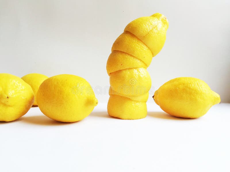 Yellow lemons and lemon peels