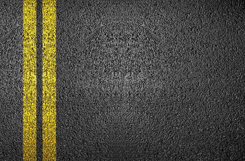 Doppia linea gialla sull'asfalto, adatto per texture astratta sfondo.