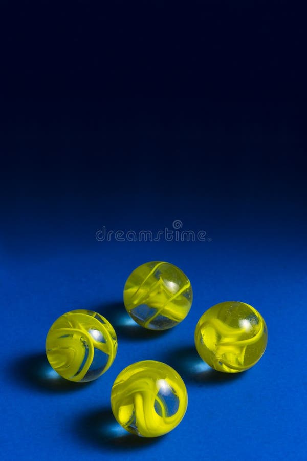 Yellow Swirl Marbles stock photo. Image of yellow, colorful 30137776