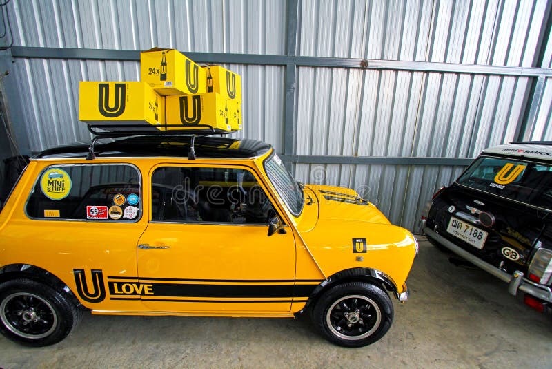 Yellow Mini Austin classic car with black wheel stock photo Yellow Mini Austin classic car with black wheel stock photo
