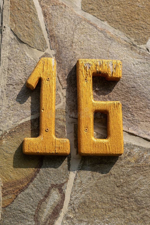 Yellow Number Sixteen on a Stone Wall Stock Photo Image of exterior Yellow Number Sixteen on a Stone Wall Stock Photo Image of exterior