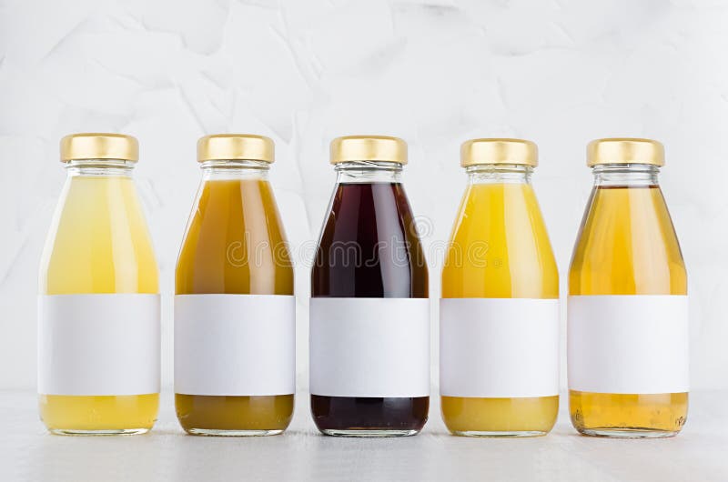 Download Yellow Orange Red Fruit Juices Large Collection In Glass Bottles With Cap White Blank Labels In Row Mock Up On White Background Stock Image Image Of Gold Healthy 192684445 Yellowimages Mockups