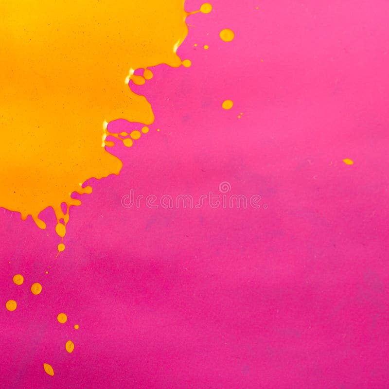 Yellow Paint Splash over Magenta Background.