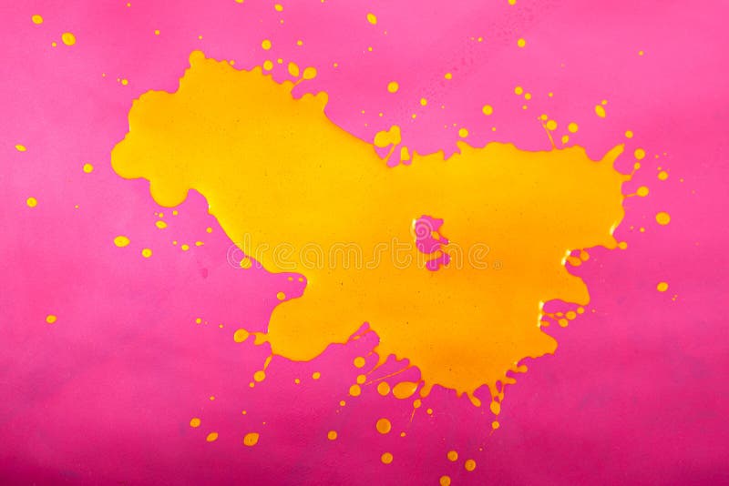 Yellow Paint Splash over Magenta Background.