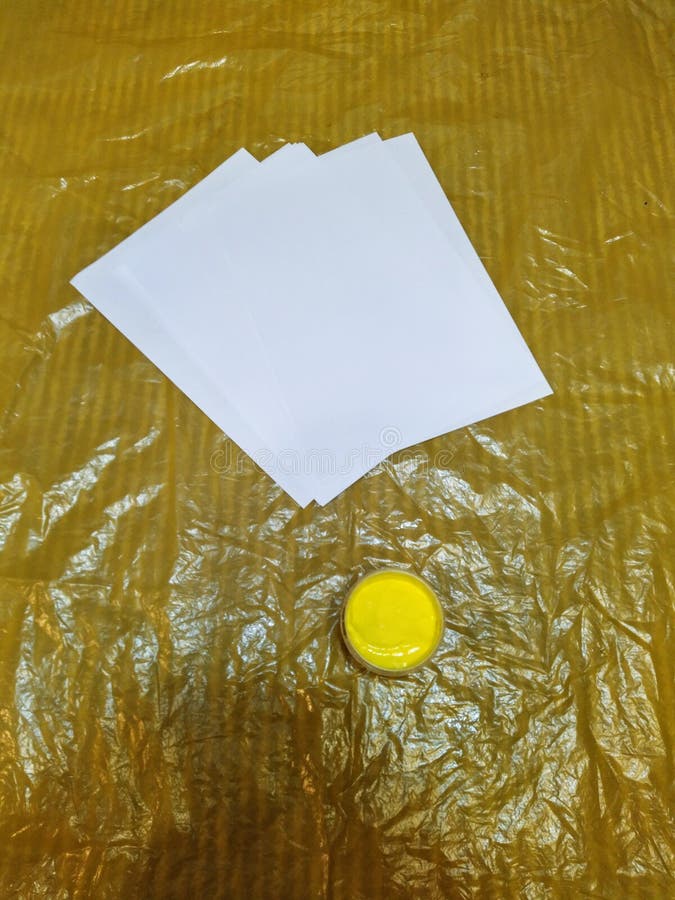 Yellow Paint and White Papers on Oilcloth Stock Photo Image of