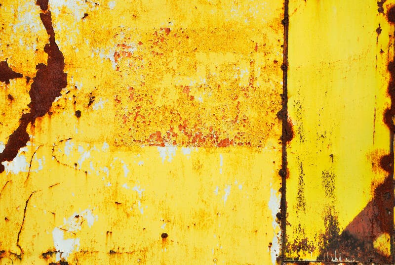 Yellow painted metal with rust texture royalty free stock photos