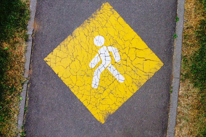 Yellow pedestrian priority sign on asphalt footpath royalty free stock photography Yellow pedestrian priority sign on asphalt footpath royalty free stock photography