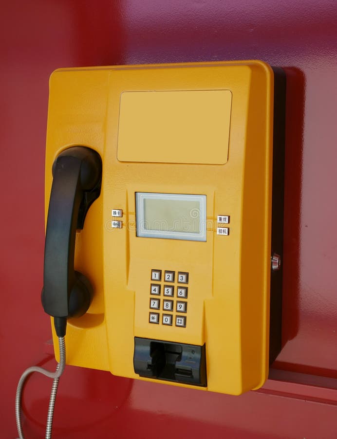 Yellow glass telephone booths with payphones are located on a pedestrian  street. Obsolete means of telephone communication in free access. Bialystok  Stock Photo - Alamy
